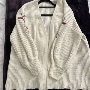 Cream cable knit cardigan with flower detail